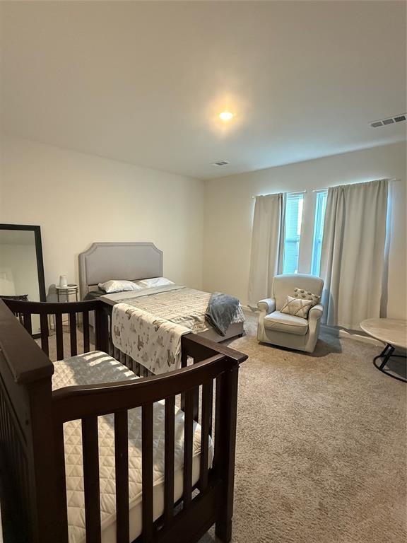 1852 McCree Street Forney, TX 75126 - Photo 6 of 21 a bedroom with furniture and a window