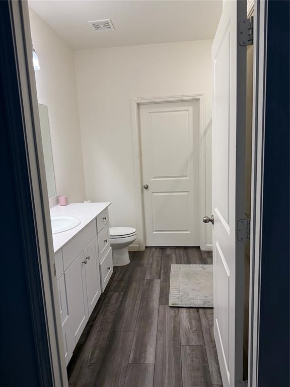 1852 McCree Street Forney, TX 75126 - Photo 7 of 21 a bathroom with a sink a toilet and a window