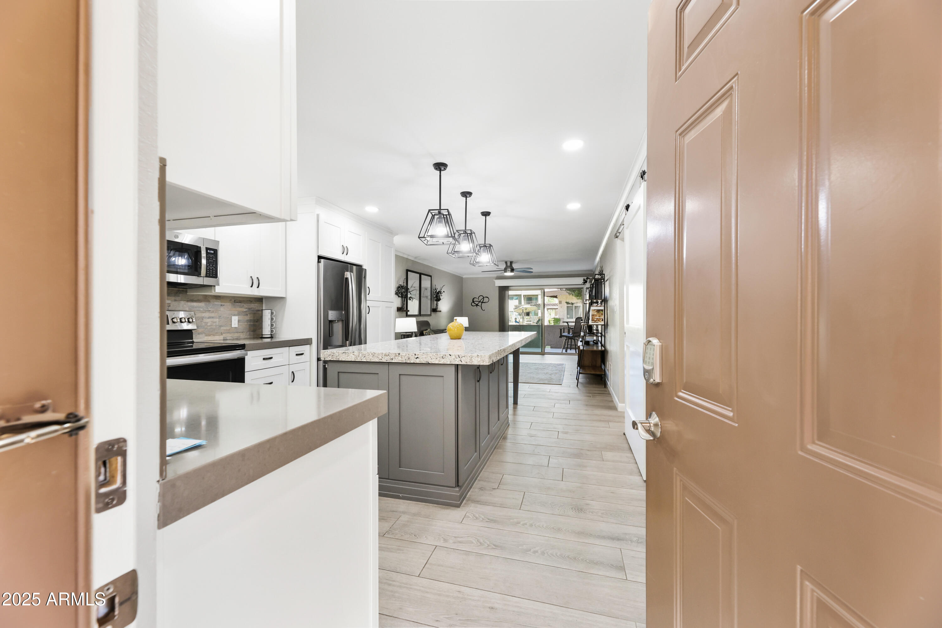 7430 East Chaparral Road, Unit A115 Scottsdale, AZ 85250 - Photo 1 of 15 a kitchen with a refrigerator and a sink