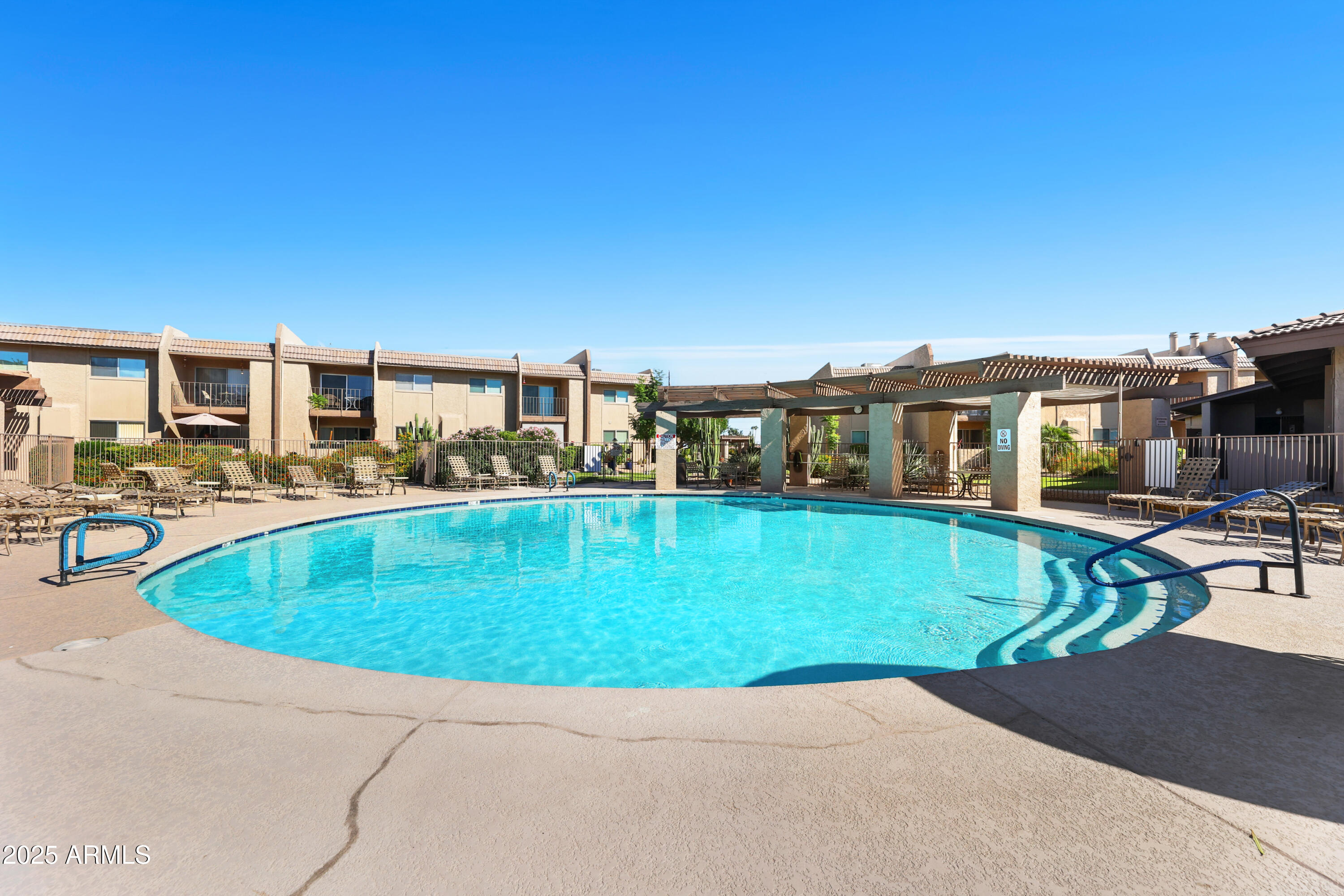 7430 East Chaparral Road, Unit A115 Scottsdale, AZ 85250 - Photo 15 of 15 a view of a house with a swimming pool