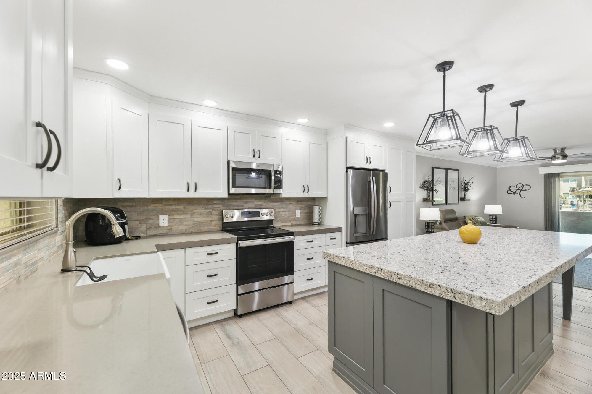 7430 East Chaparral Road, Unit A115 Scottsdale, AZ 85250 - Photo 2 of 15 a kitchen with stainless steel appliances granite countertop a sink dishwasher stove refrigerator and cabinets