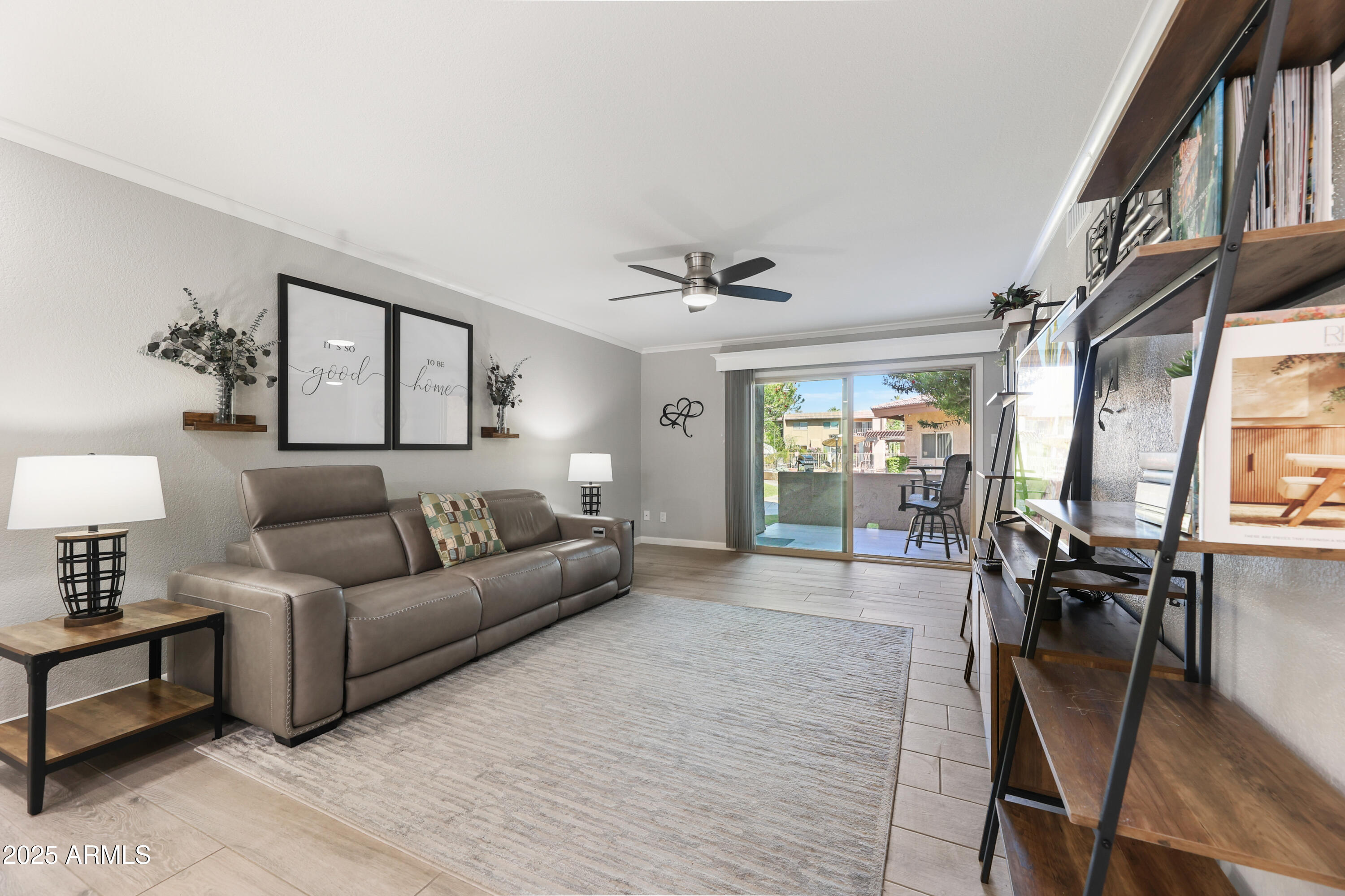 7430 East Chaparral Road, Unit A115 Scottsdale, AZ 85250 - Photo 5 of 15 a living room with furniture a couch and a window
