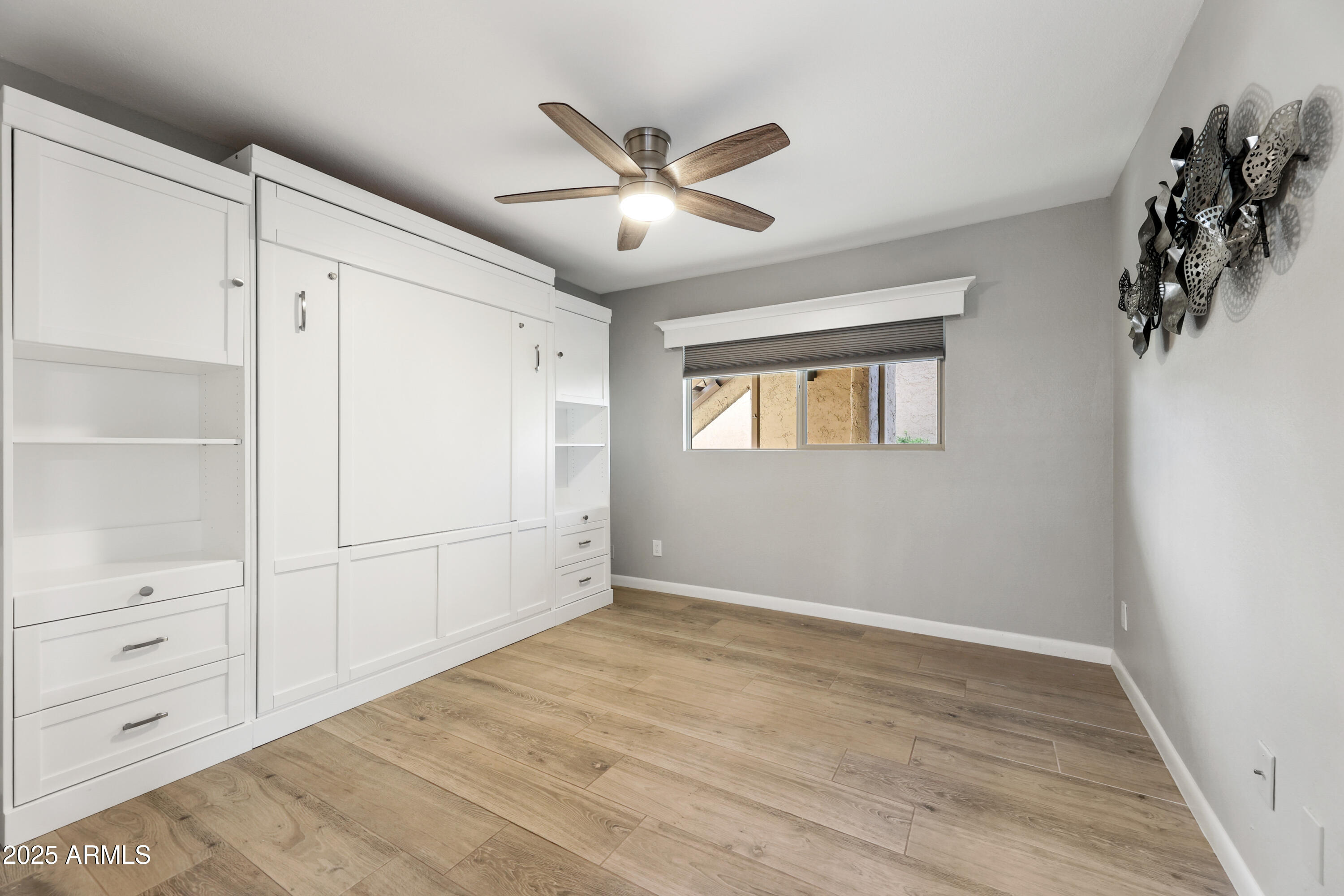 7430 East Chaparral Road, Unit A115 Scottsdale, AZ 85250 - Photo 9 of 15 a view of an empty room with a window