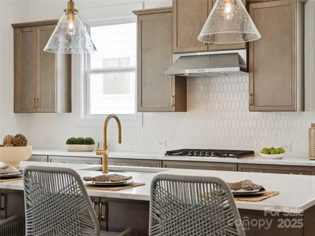 a kitchen with a sink and a stove