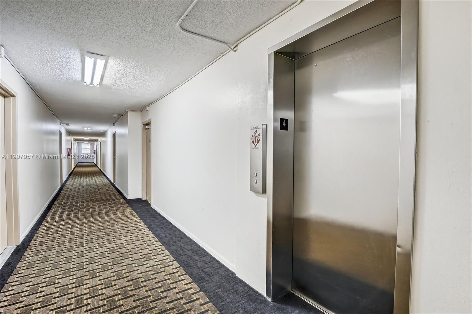 6500 Cypress Road, Unit 410 Plantation, FL 33317 - Photo 21 of 33 a view of hallway with wooden floor