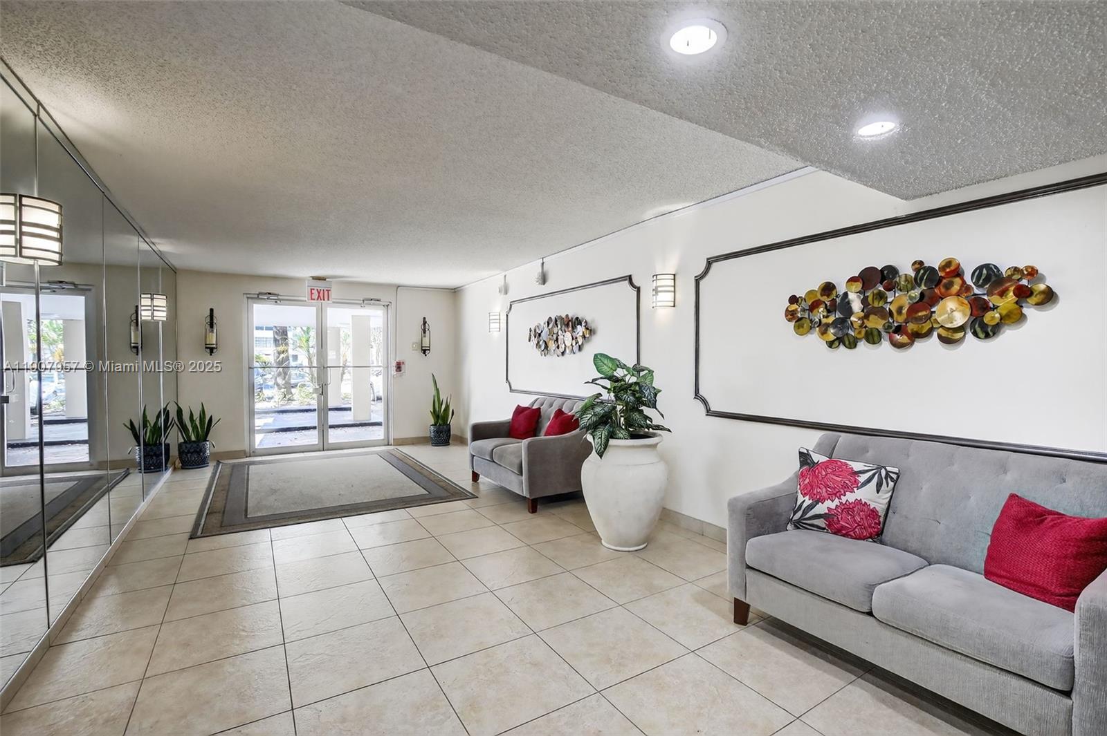 6500 Cypress Road, Unit 410 Plantation, FL 33317 - Photo 23 of 33 a living room with furniture and a large window