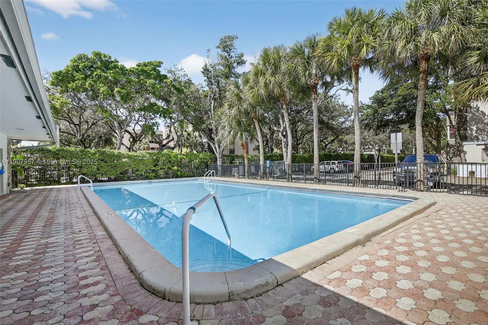6500 Cypress Road, Unit 410 Plantation, FL 33317 - Photo 26 of 33 a view of a swimming pool with a patio