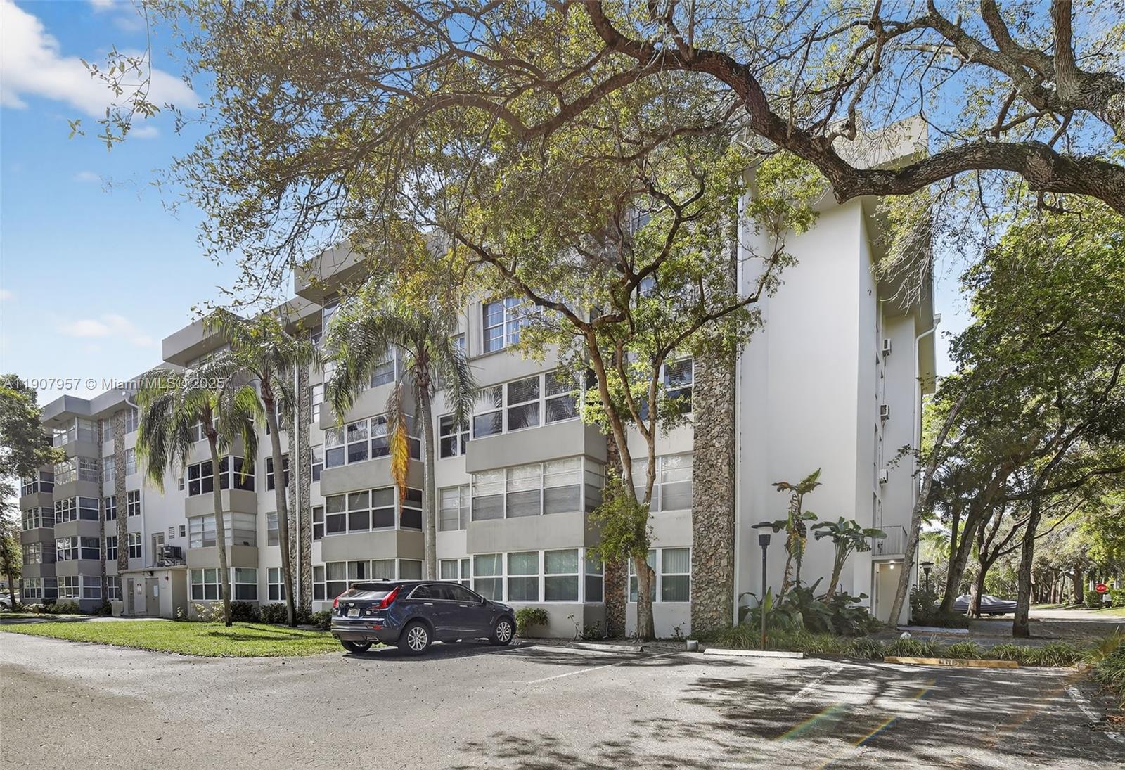 6500 Cypress Road, Unit 410 Plantation, FL 33317 - Photo 31 of 33 a cars parked on the side of a street