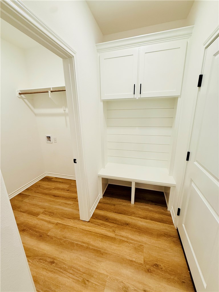 1202 Suncrest Street Bryan, TX 77803 - Photo 18 of 21 a view of a room with wooden floor and white walls