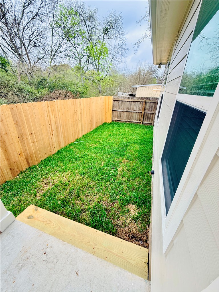 1202 Suncrest Street Bryan, TX 77803 - Photo 20 of 21 a view of a backyard with a garden