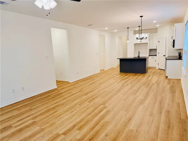 a view of kitchen with wooden floor