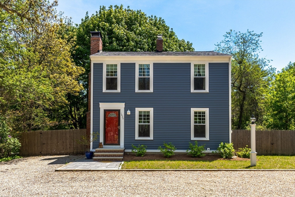 1020 Old Falmouth Road Barnstable, MA 02632 - Photo 2 of 42 a front view of a house with garden