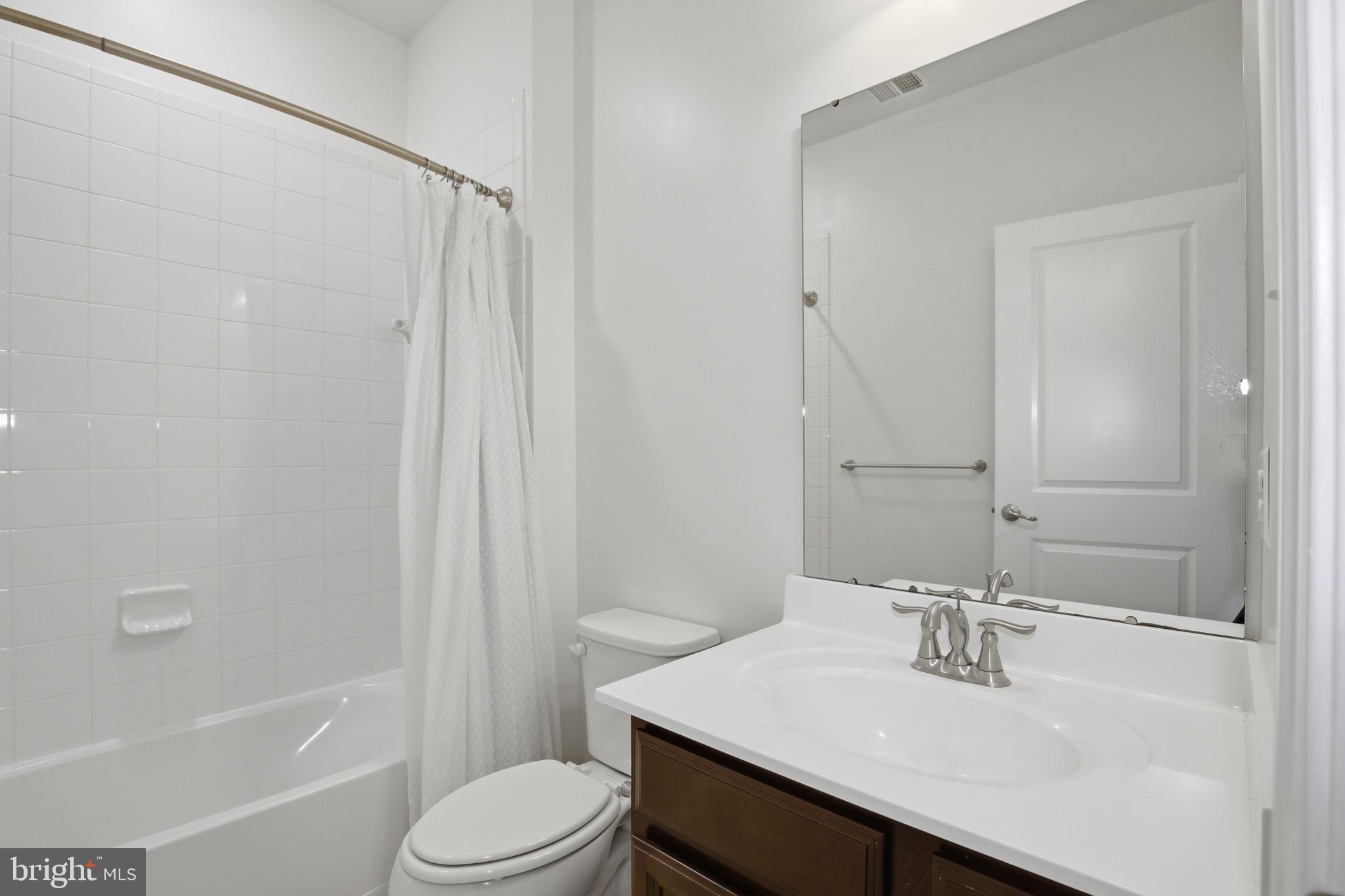2784 Fredericksburg Road Hanover, MD 21076 - Photo 47 of 60 a bathroom with a sink toilet and shower