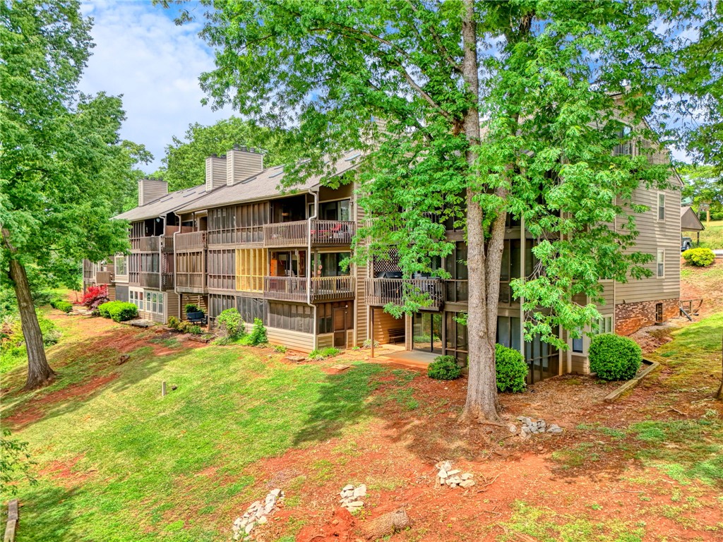 104 Captains Way Anderson, SC 29625 - Photo 19 of 47 This multi-level residence features inviting screened porches nestled amidst lush natural surroundings.