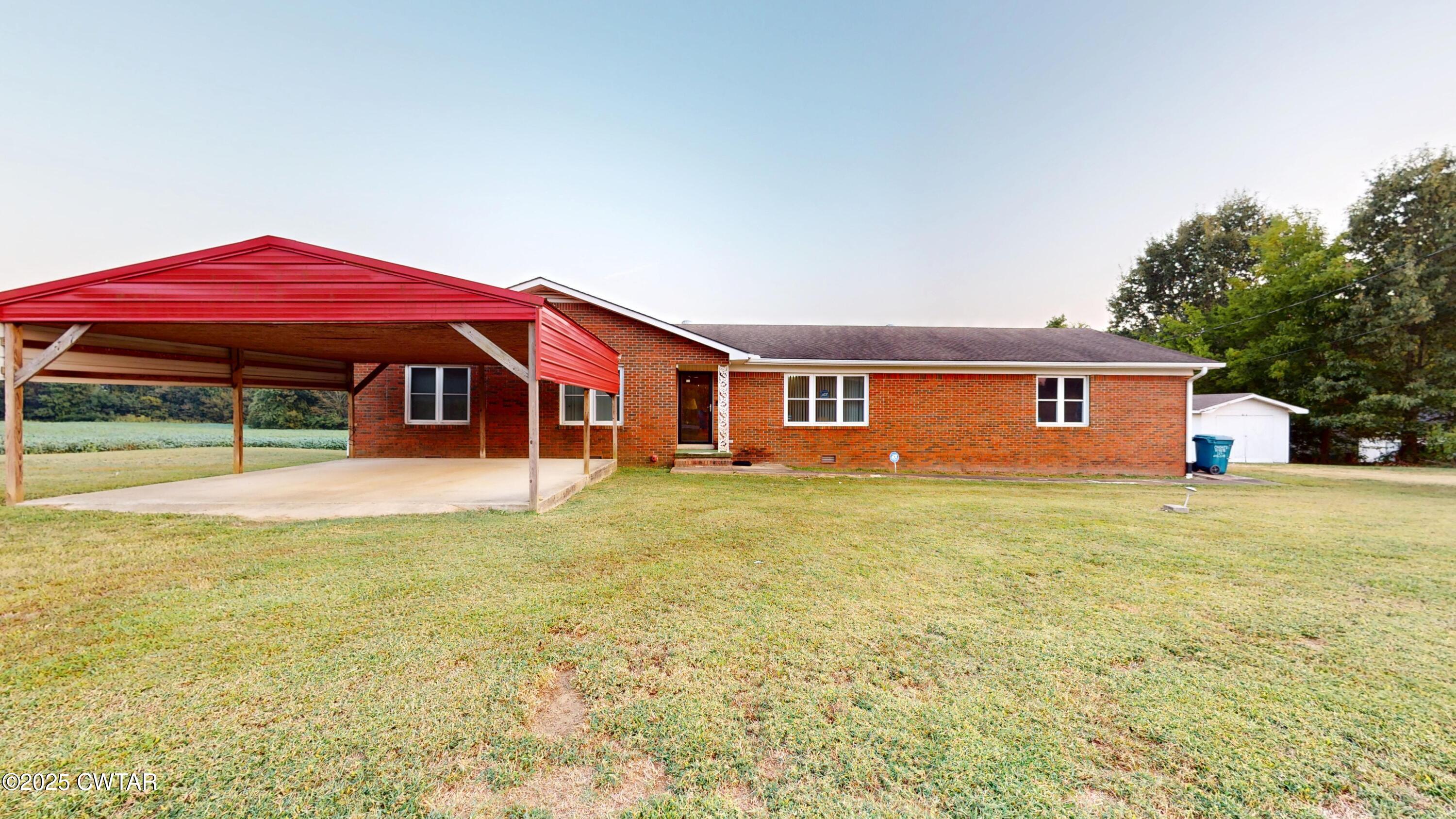 a front view of a house with yard and porch