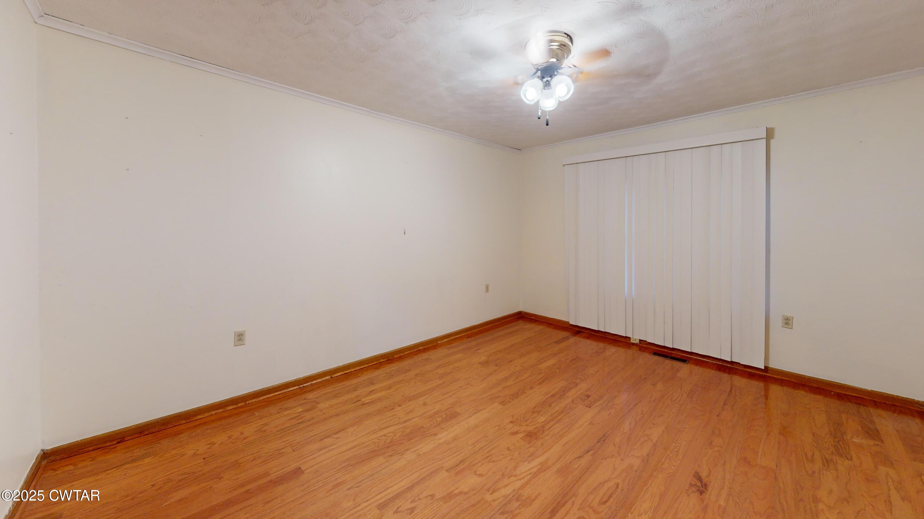 65 Lightfoot Luckett Road Ripley, TN 38063 - Photo 19 of 30 a view of an empty room with a chandelier fan