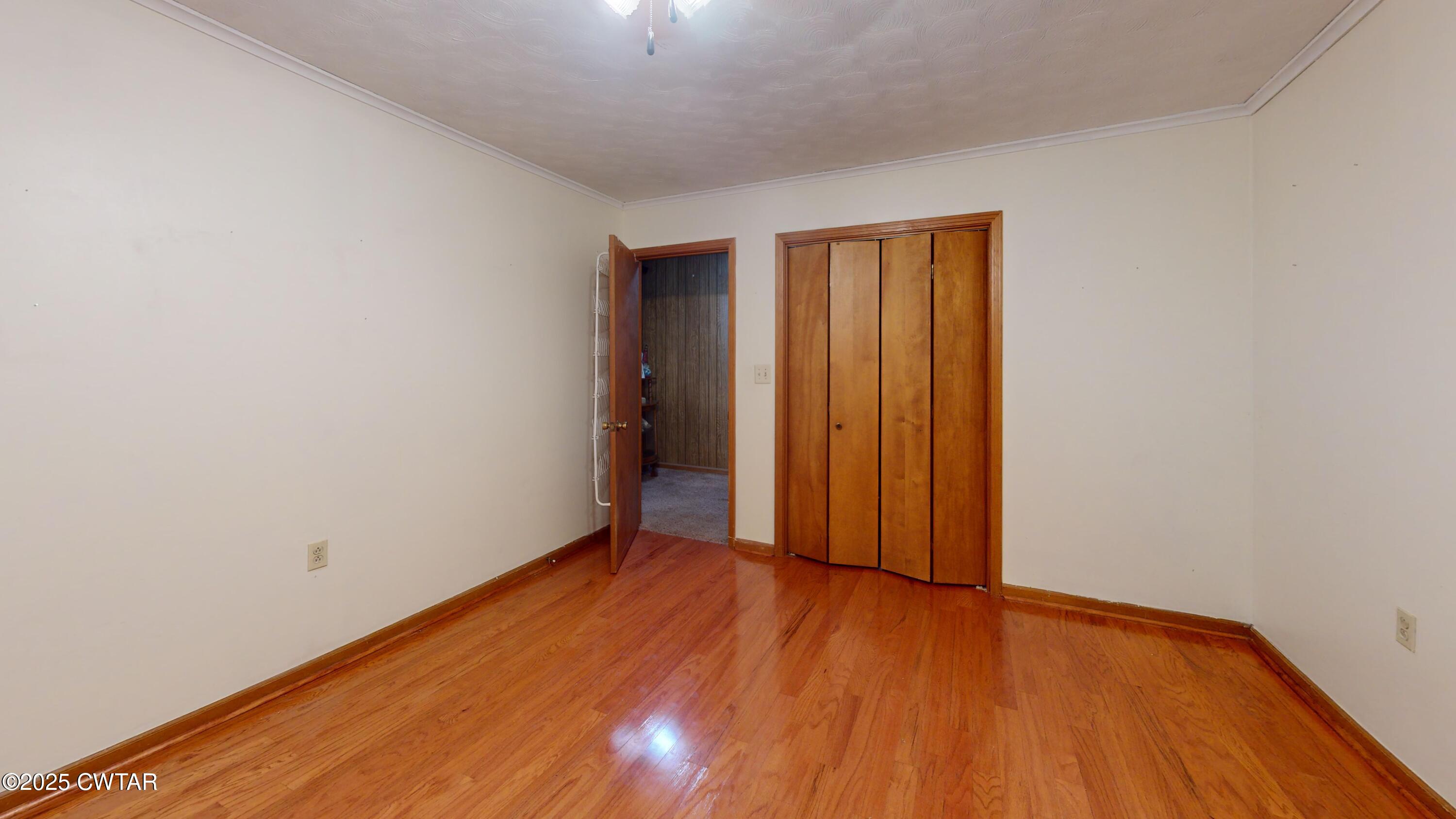 65 Lightfoot Luckett Road Ripley, TN 38063 - Photo 20 of 30 an empty room with wooden floor and closet
