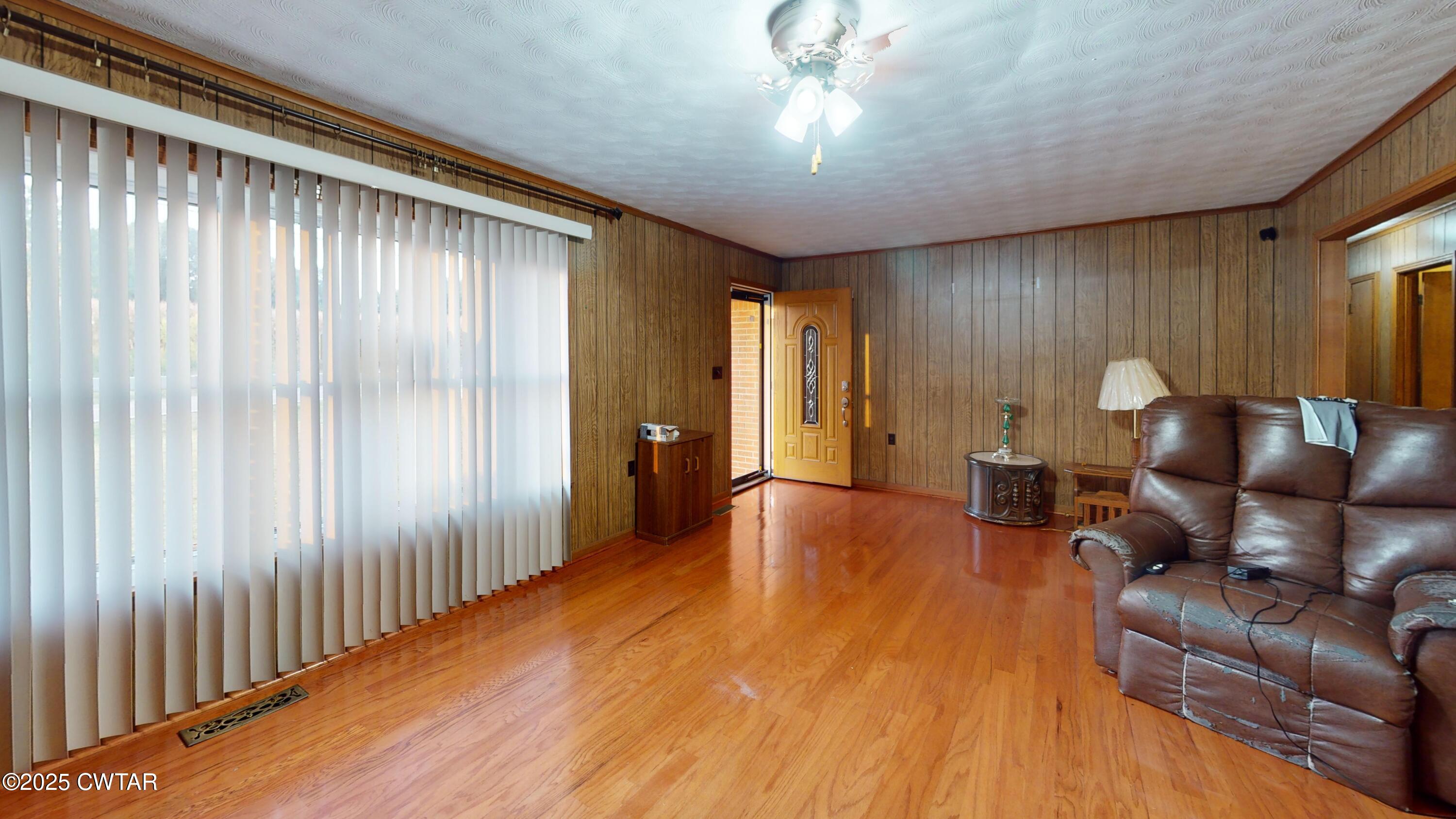 65 Lightfoot Luckett Road Ripley, TN 38063 - Photo 6 of 30 a living room with furniture and a wooden floor