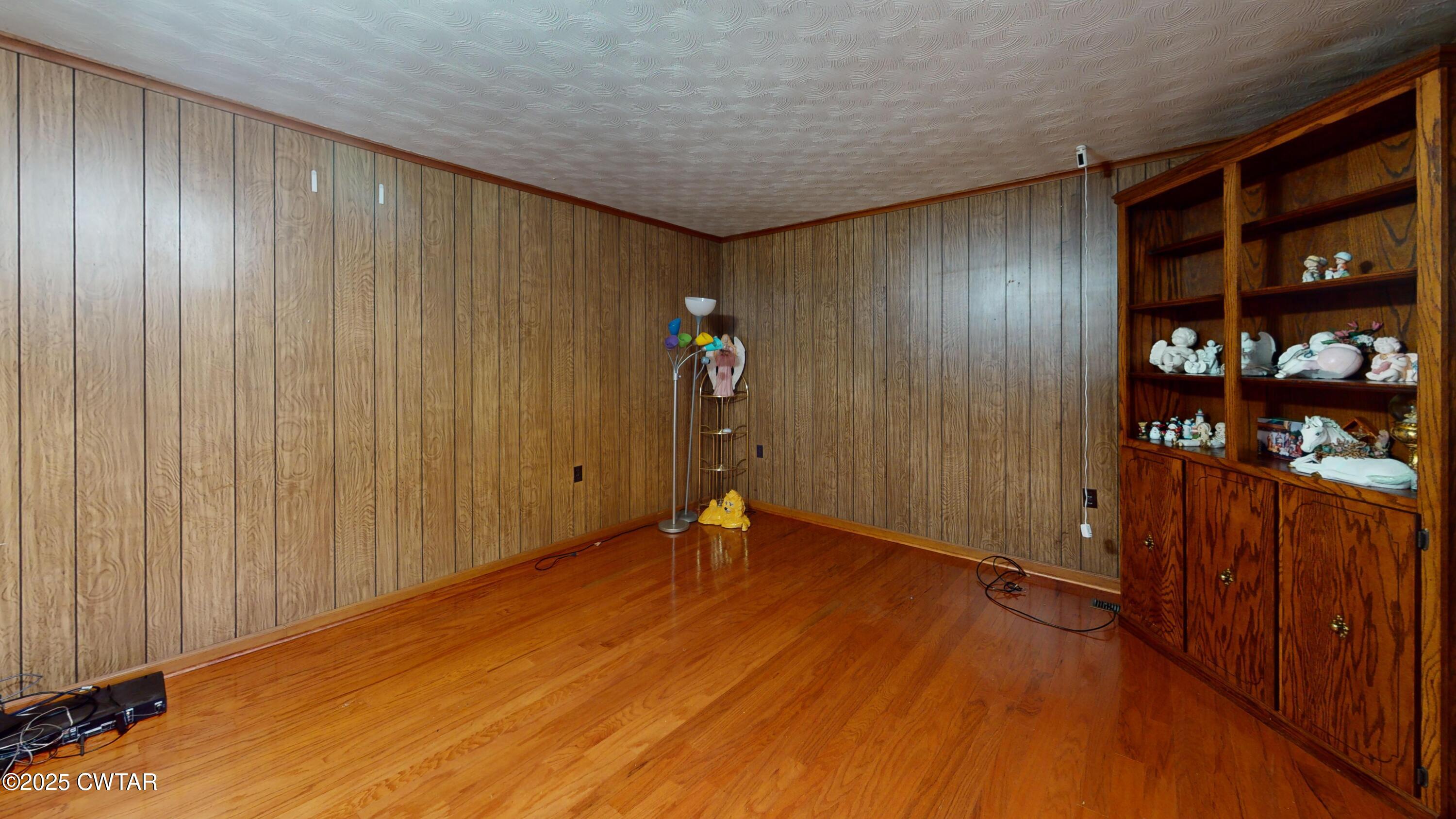 65 Lightfoot Luckett Road Ripley, TN 38063 - Photo 7 of 30 a view of an empty room with wooden floor and stairs