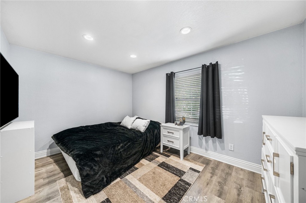 8526 San Vicente Avenue Riverside, CA 92504 - Photo 18 of 30 a bedroom with a bed and a window