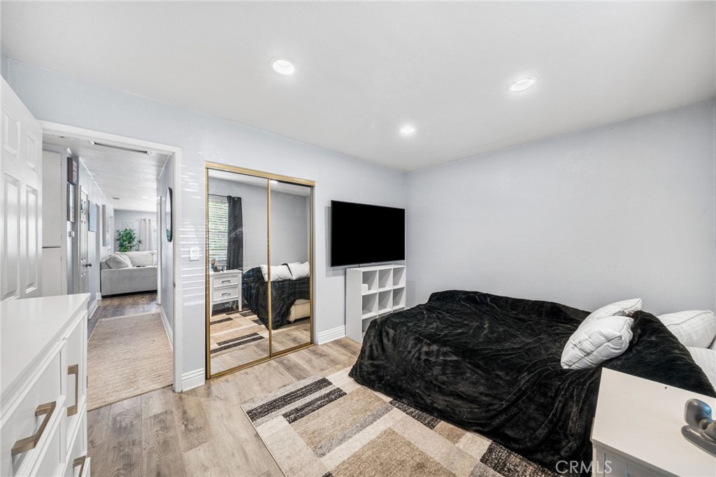 8526 San Vicente Avenue Riverside, CA 92504 - Photo 19 of 30 a living room with furniture and a flat screen tv
