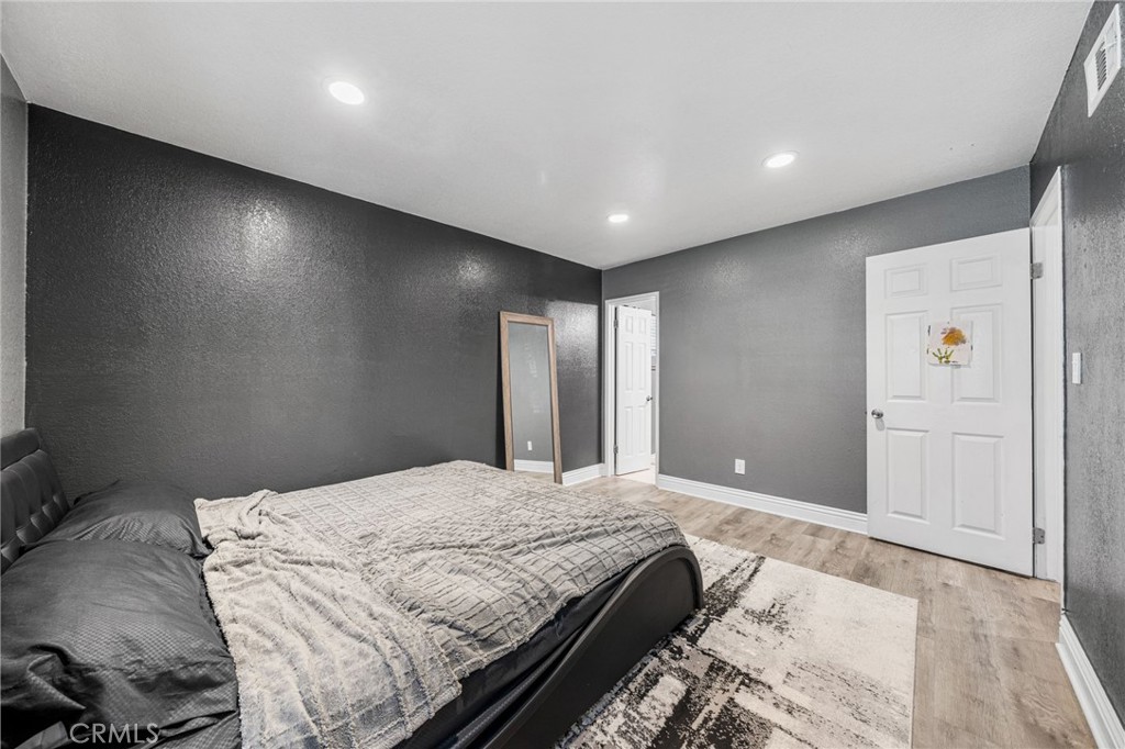 8526 San Vicente Avenue Riverside, CA 92504 - Photo 21 of 30 a large bed sitting in a large room