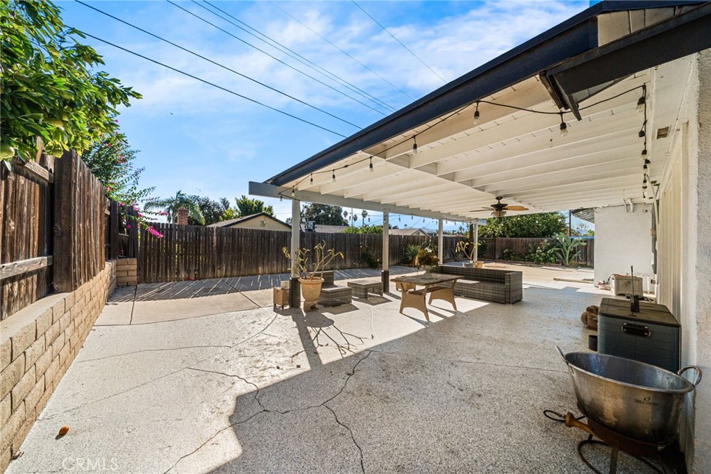 8526 San Vicente Avenue Riverside, CA 92504 - Photo 24 of 30 a view of a patio with a table and chairs under an umbrella
