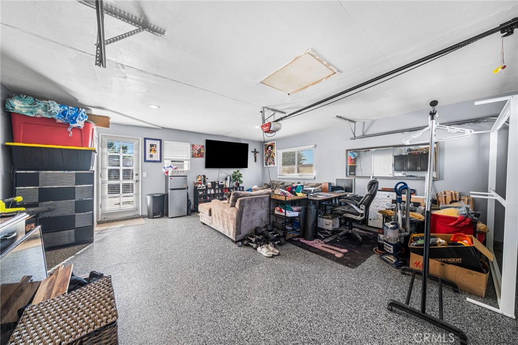 8526 San Vicente Avenue Riverside, CA 92504 - Photo 28 of 30 a bed room with furniture and a flat screen tv