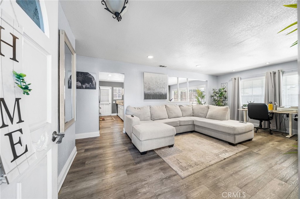 8526 San Vicente Avenue Riverside, CA 92504 - Photo 3 of 30 a living room with furniture and a large window