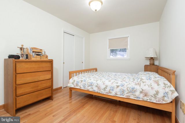 a bedroom with a bed and closet