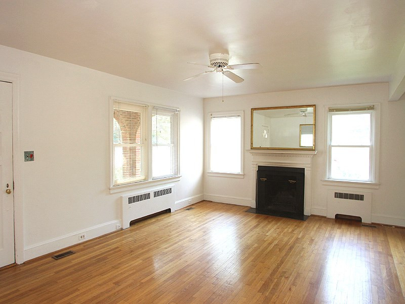 209 Dixie Trail Raleigh, NC 27607 - Photo 12 of 12 Living room with fireplace and hardwood floors