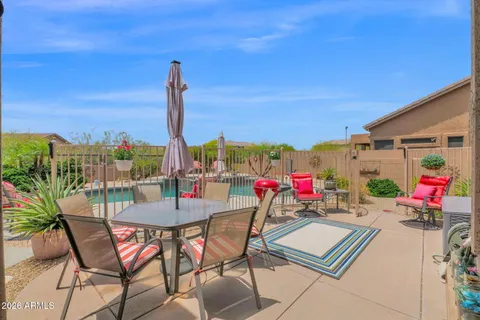 a view of a swimming pool with a patio