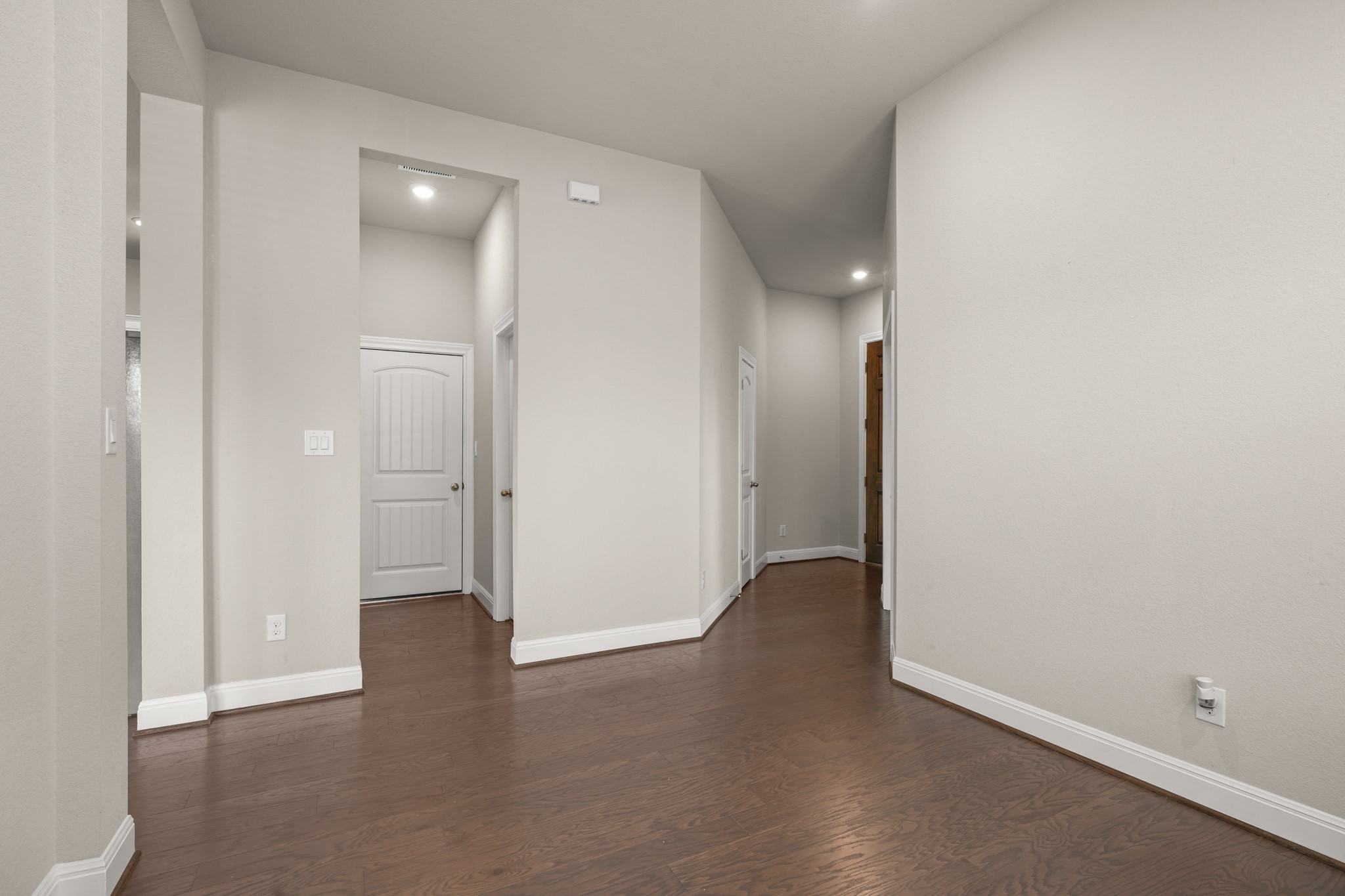 2209 Hat Bender Loop Round Rock, TX 78664 - Photo 9 of 25 an empty room with wooden floor and windows