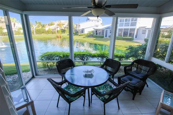 a outdoor dining space with furniture and garden view