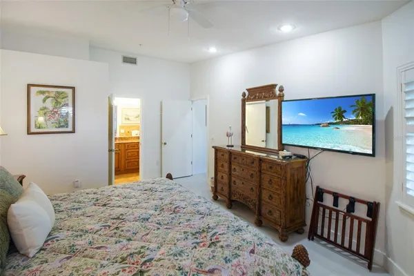 a bedroom with furniture and window