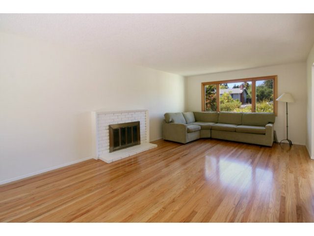 209 Segre Place Santa Cruz, CA 95060 - Photo 11 of 24 a living room with furniture and a fireplace