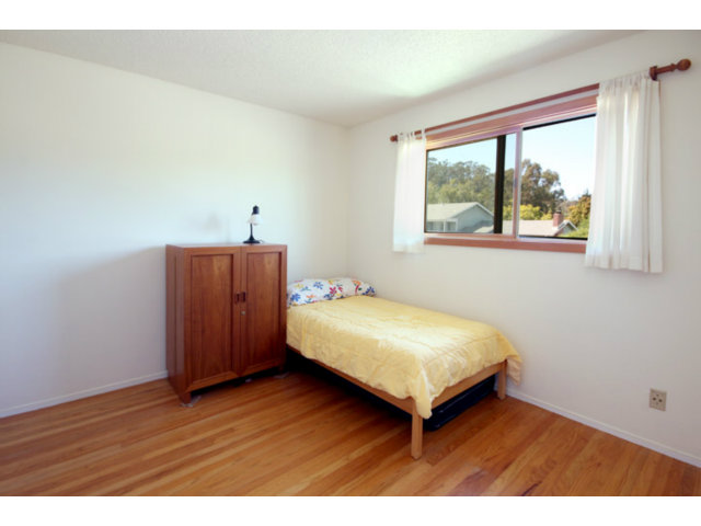 209 Segre Place Santa Cruz, CA 95060 - Photo 15 of 24 a bedroom with a bed and a window