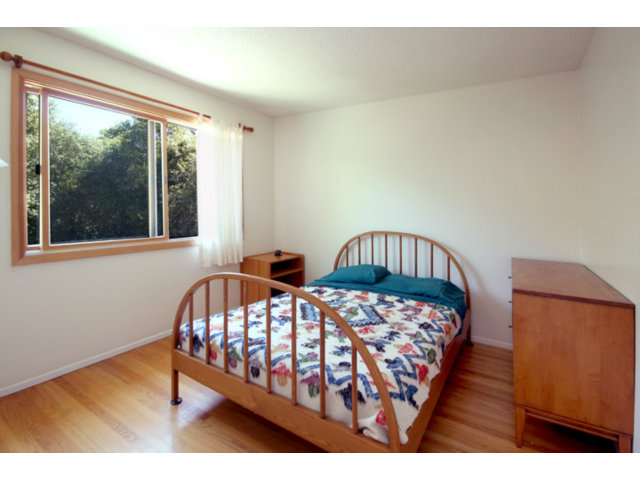 209 Segre Place Santa Cruz, CA 95060 - Photo 16 of 24 a bedroom with two beds and wooden floor