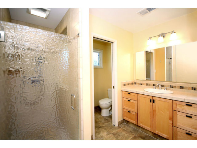 209 Segre Place Santa Cruz, CA 95060 - Photo 17 of 24 a bathroom with a double vanity sink toilet and shower
