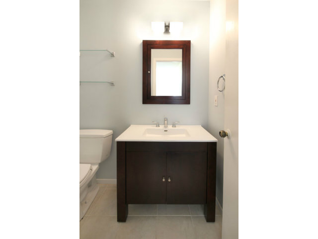 209 Segre Place Santa Cruz, CA 95060 - Photo 18 of 24 a bathroom with a sink vanity and mirror