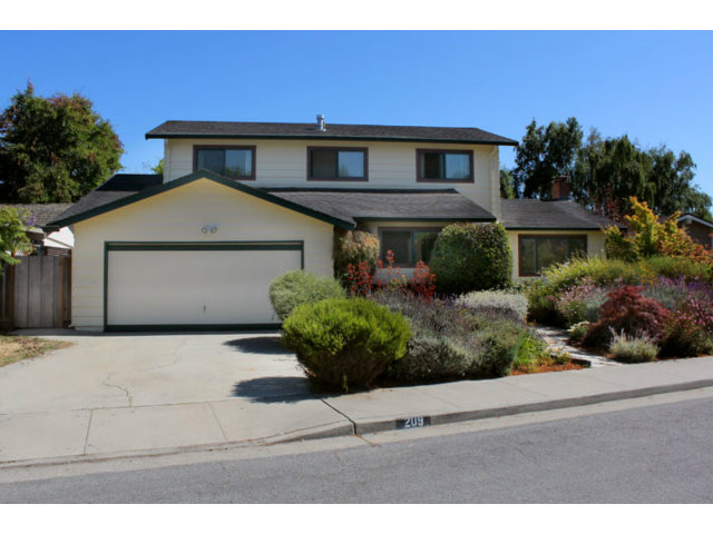 209 Segre Place Santa Cruz, CA 95060 - Photo 23 of 24 a front view of a house with a yard and garage