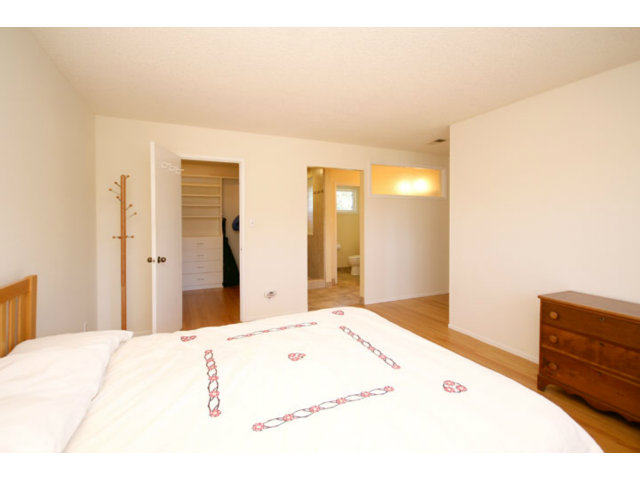 209 Segre Place Santa Cruz, CA 95060 - Photo 6 of 24 a bedroom with a bed and a dresser