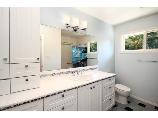 209 Segre Place Santa Cruz, CA 95060 - Photo 7 of 24 a bathroom with a sink a toilet and mirror