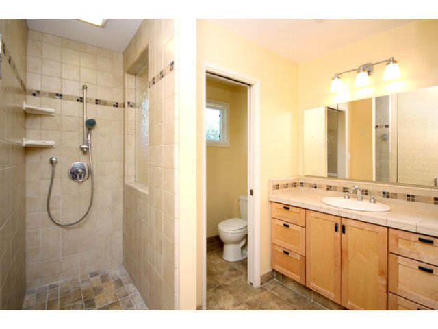 209 Segre Place Santa Cruz, CA 95060 - Photo 8 of 24 a bathroom with a double vanity sink mirror and shower