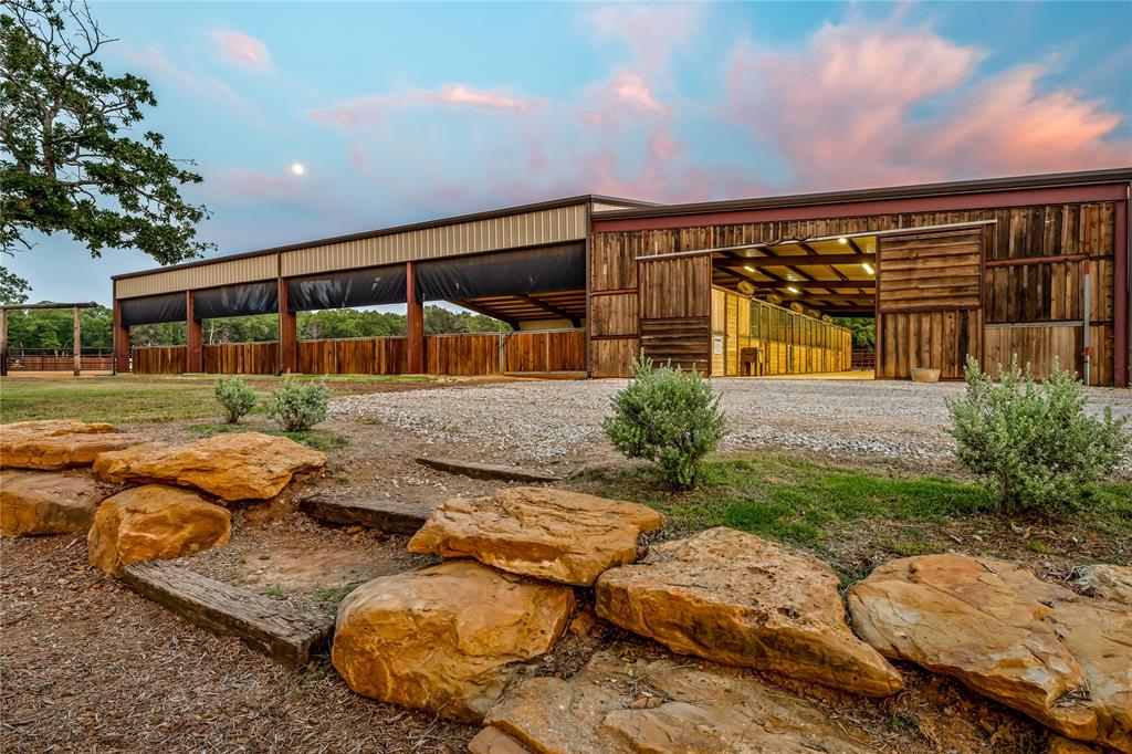 3113 Rock Creek Road Mineral Wells, TX 76067 - Photo 1 of 37 a view of backyard with seating area and barbeque oven