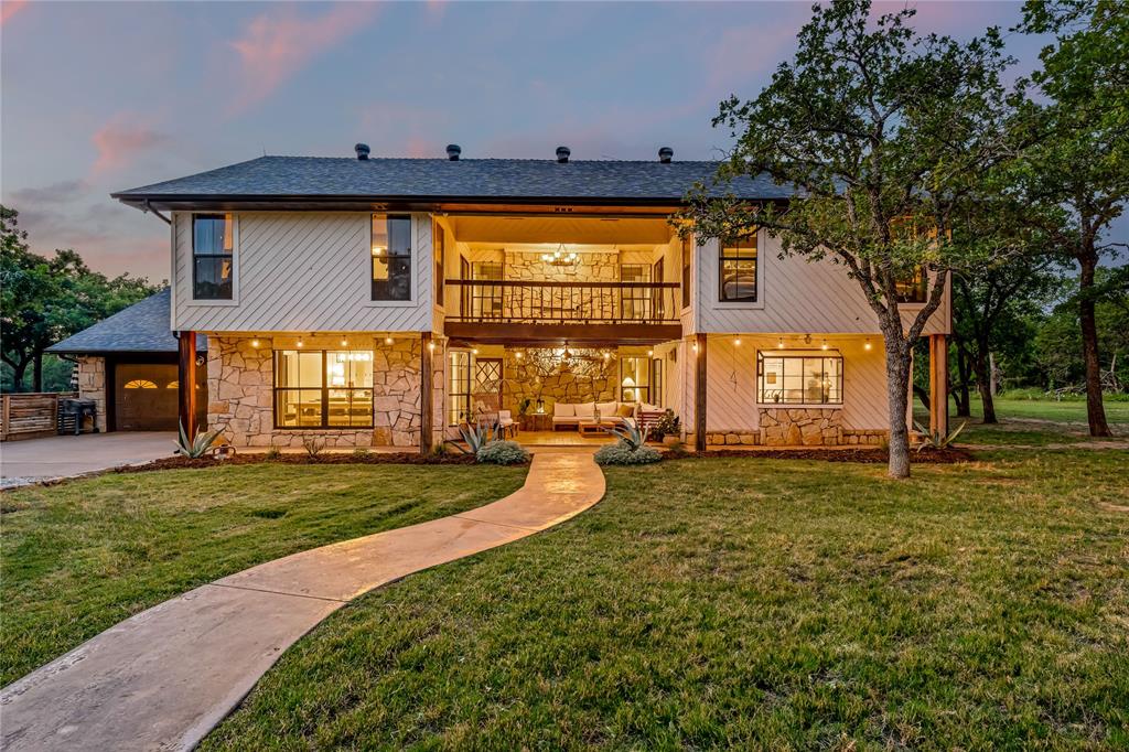 3113 Rock Creek Road Mineral Wells, TX 76067 - Photo 12 of 37 a view of a house with backyard and a patio