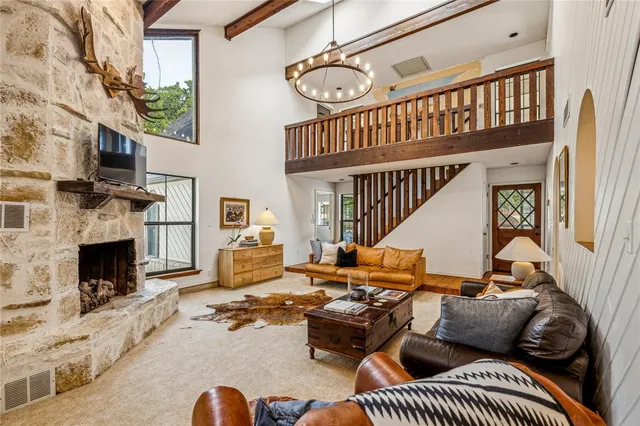 a view of a livingroom with furniture and windows