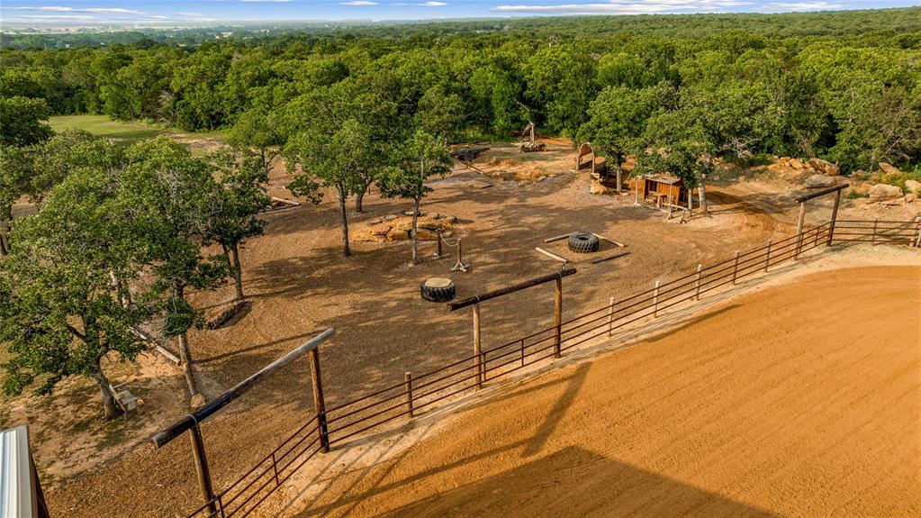 3113 Rock Creek Road Mineral Wells, TX 76067 - Photo 24 of 37 a view of a yard with an outdoor space