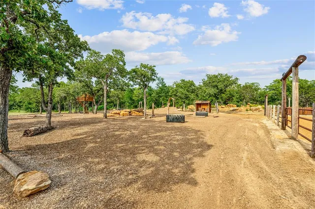 a view of a park with swings and slides