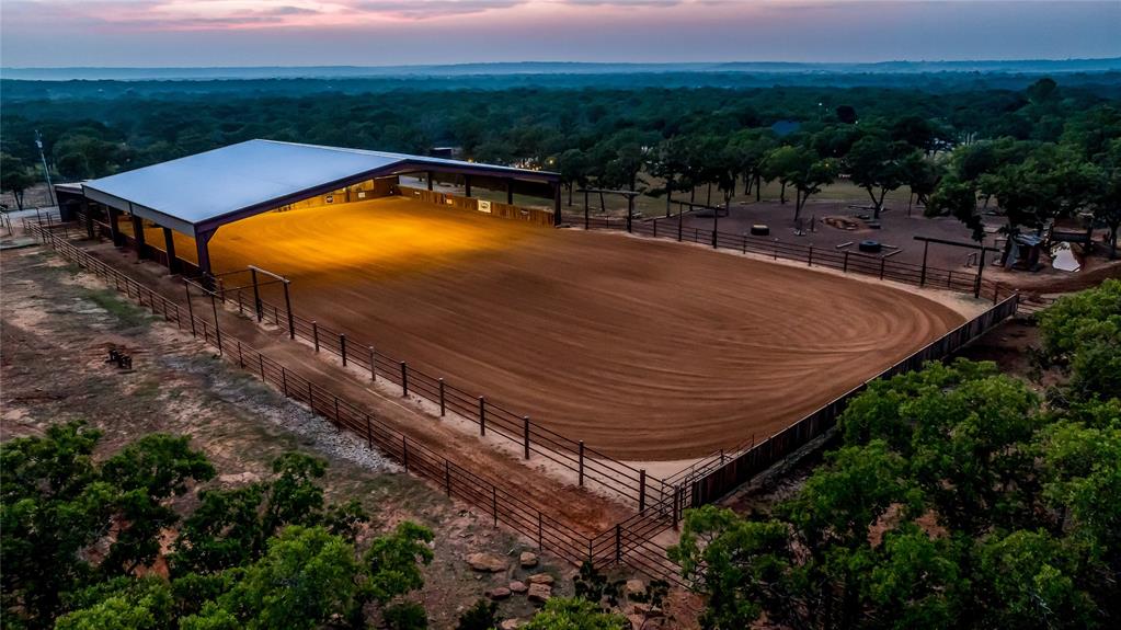 3113 Rock Creek Road Mineral Wells, TX 76067 - Photo 34 of 37 a view of a tennis ground and a mountain view in back